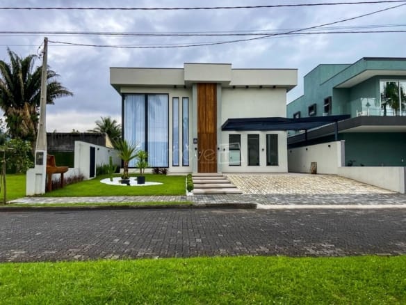Casa à Venda em Massaguaçu no Condomínio Costa Nova Residence com 4 quartos e 357m²