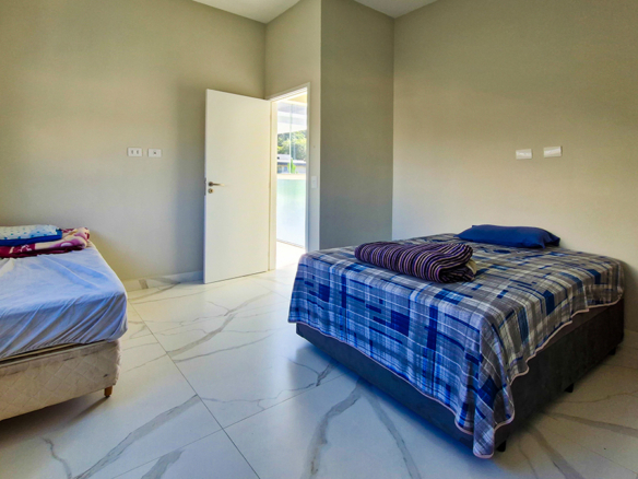 Casa à Venda no Condomínio Costa Nova Residence, em Massaguaçu com 4 suítes e 300m²